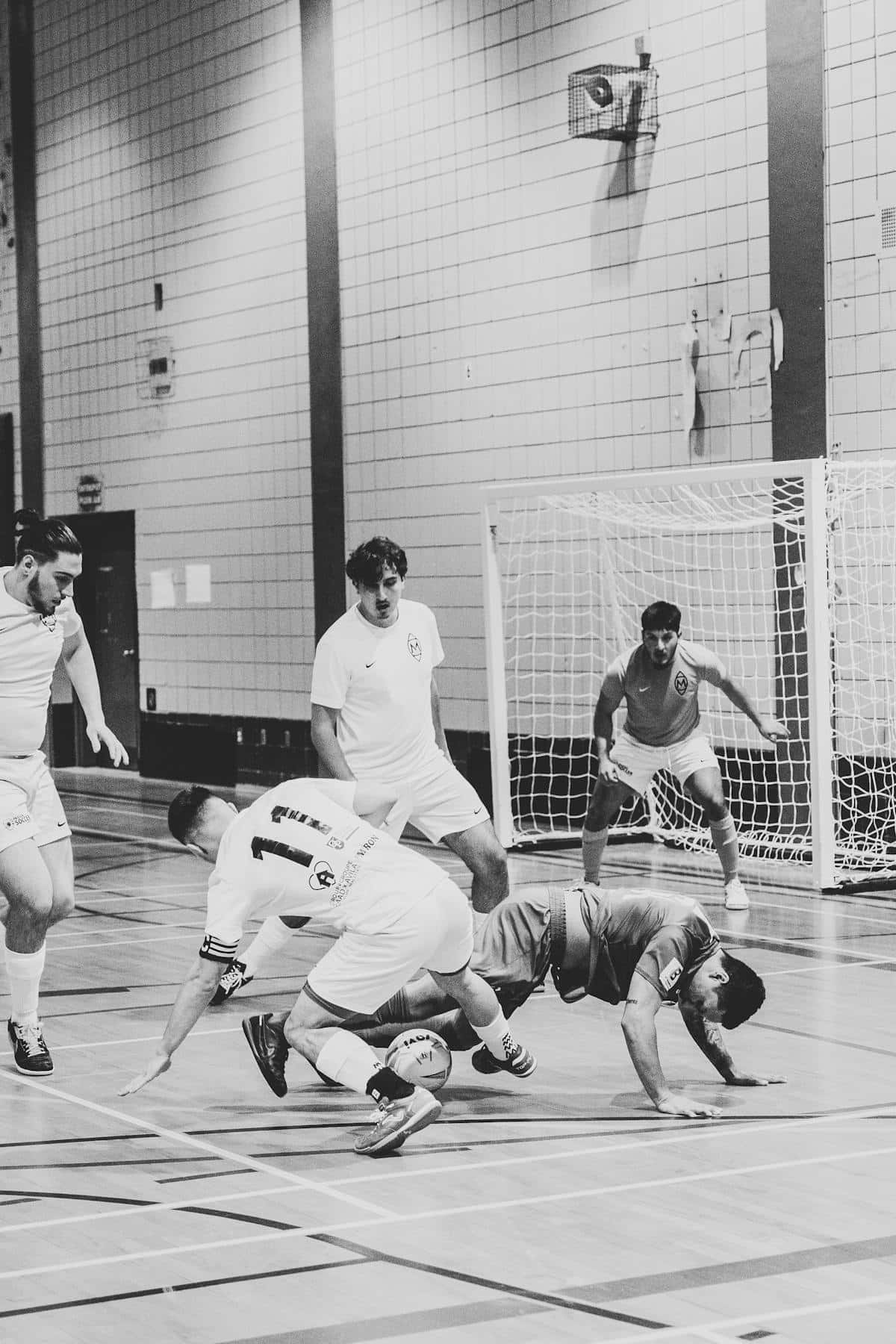 Custom futsal socks category cover image showing players on an indoor court