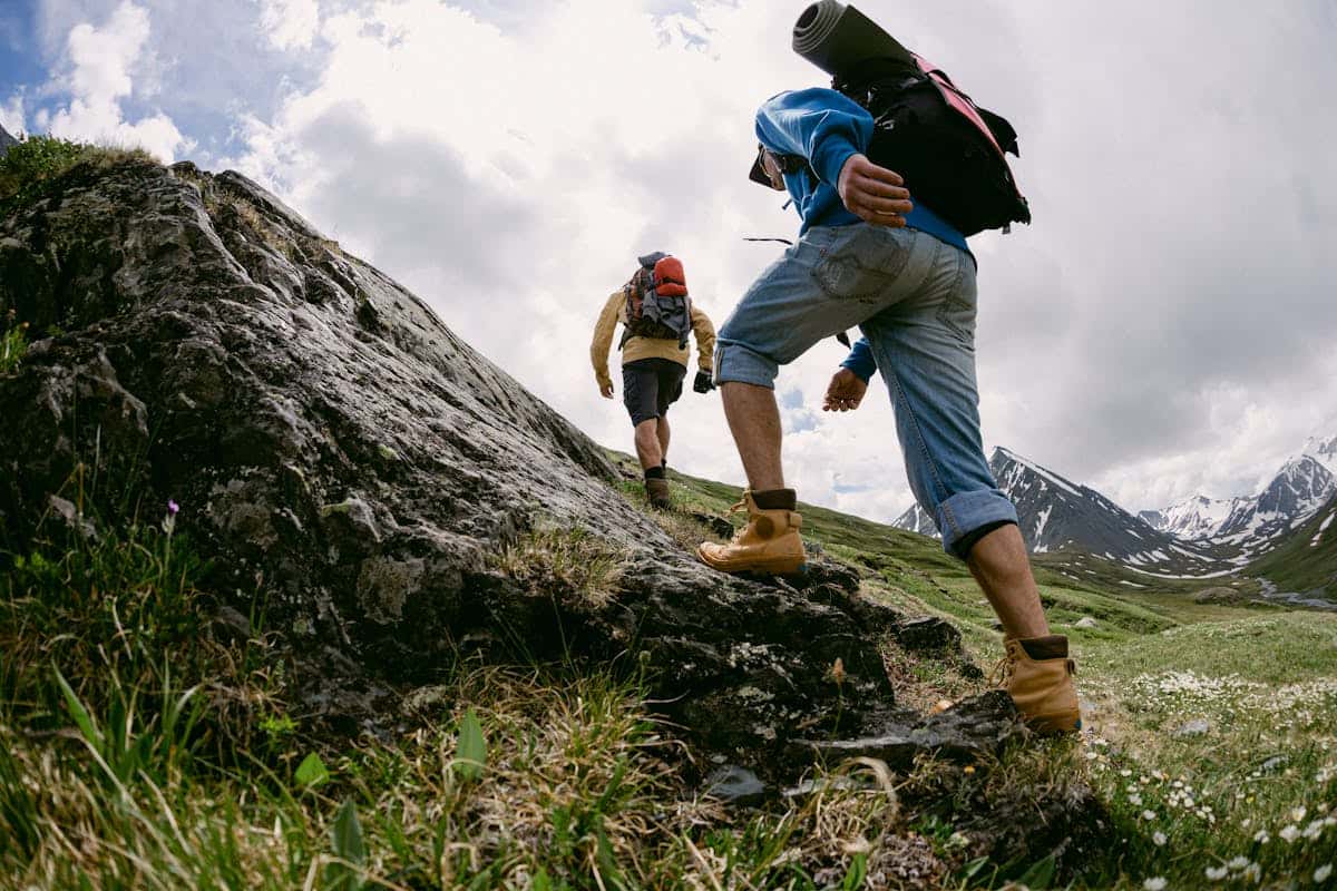 Custom hiking socks category cover image showing hikers on a mountain trail