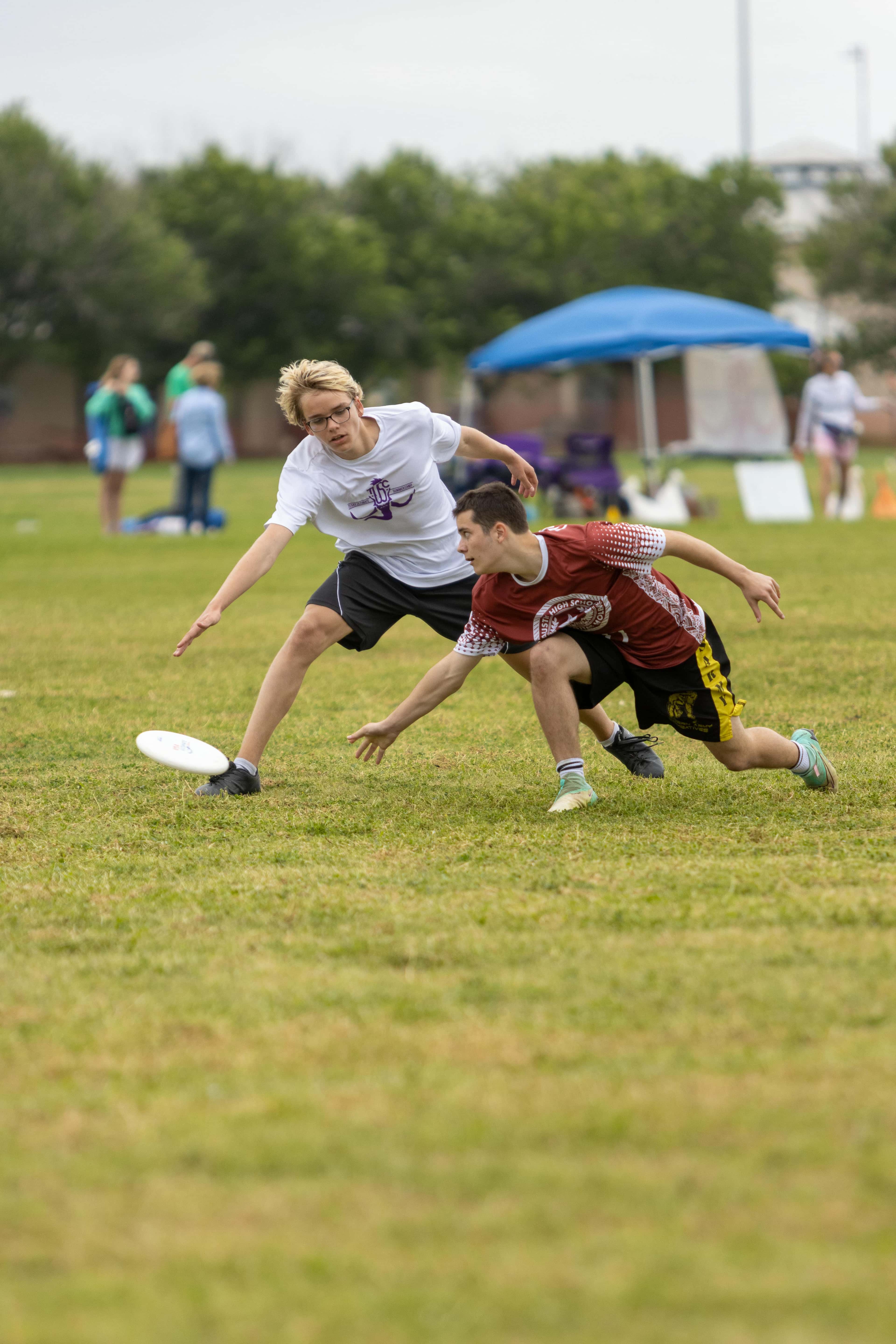 Custom ultimate frisbee socks category cover image showing players competing for the disc