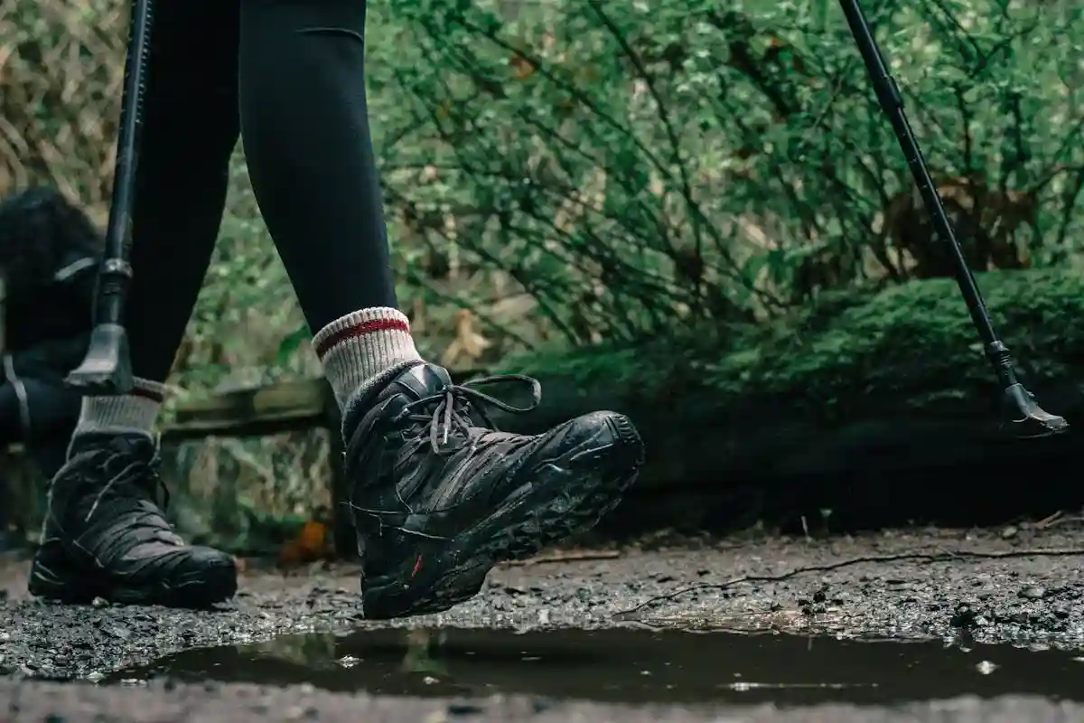 Custom hiking socks category cover image showing hiker on a trail