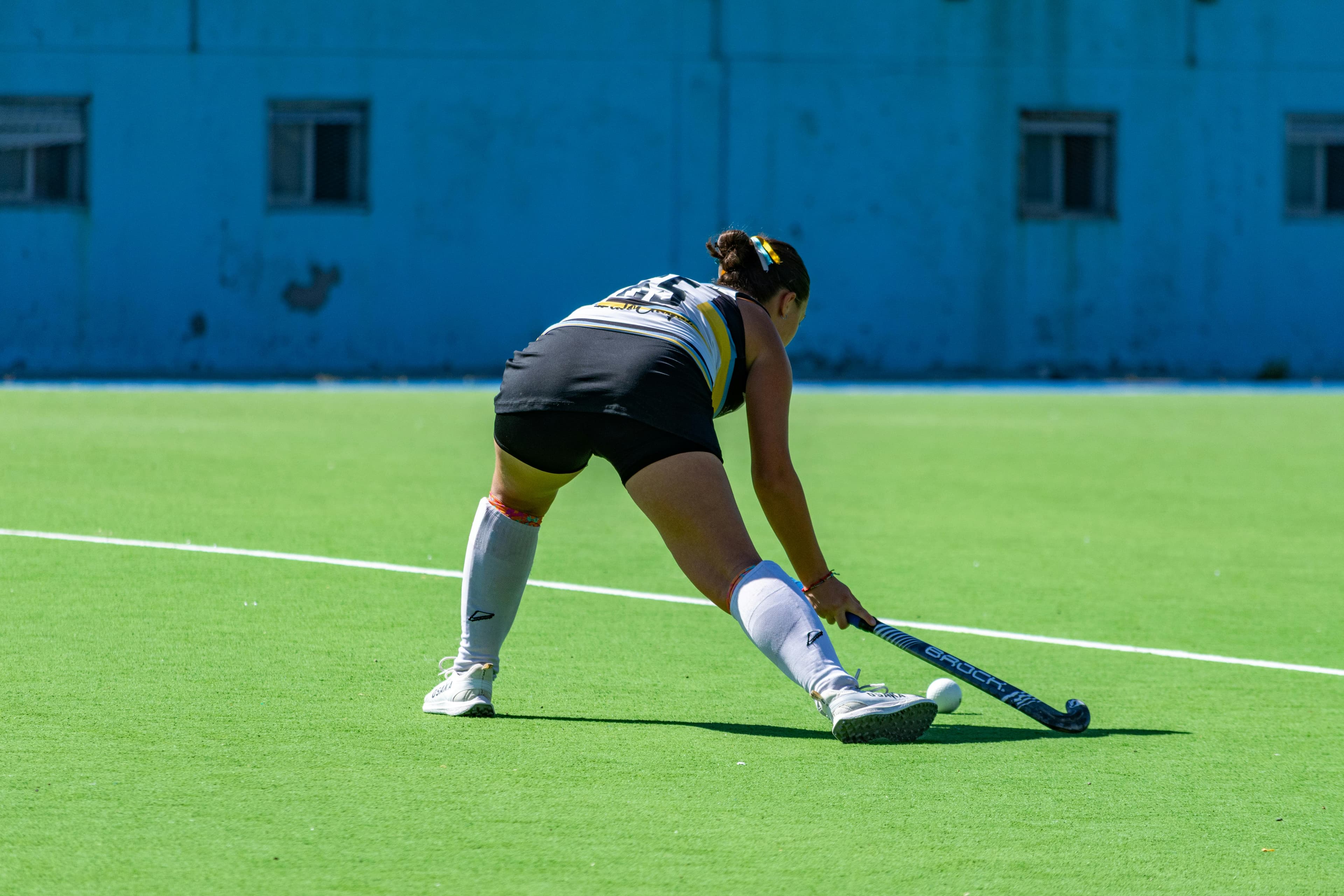 Custom field hockey socks shown in wear and fit detail