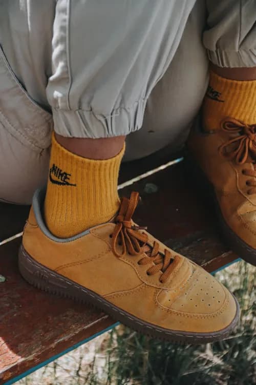 Gold athletic socks and tan shoes
