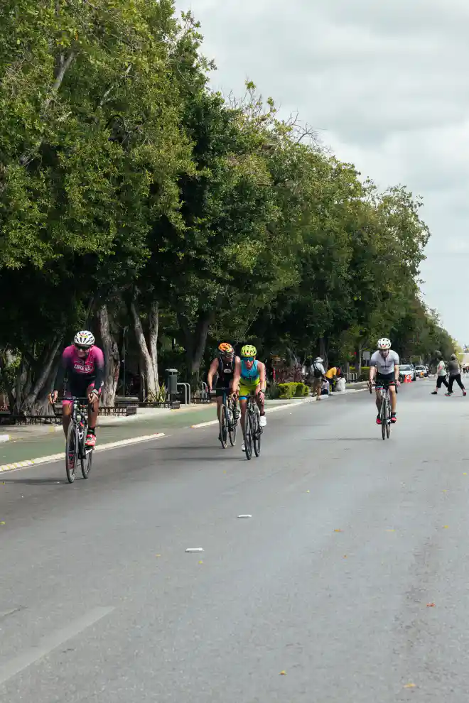 Cyclists riding together on a city road