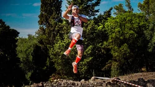 Trail runner wearing bright orange performance socks