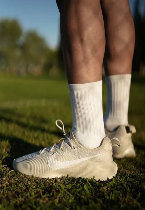 White running socks and shoes on grass