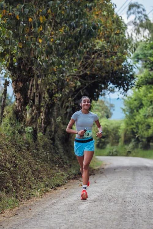 Woman runner on a wooded trail