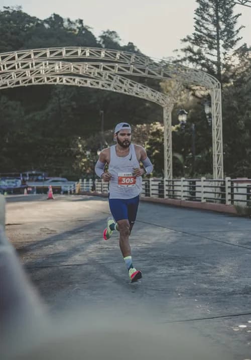 Marathon runner crossing a bridge